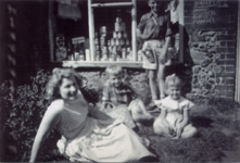 Jackson family outside Reeve's shop, mid 1950s