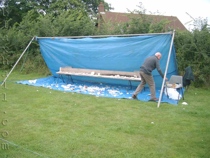 Malcolm turns away from a wayward ball from the public… or was it Viv??